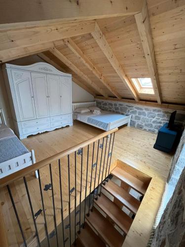 an attic room with two beds and a staircase at Casa Vecchia in Kotor