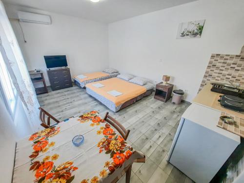 Postel nebo postele na pokoji v ubytování Apartments Chipsy