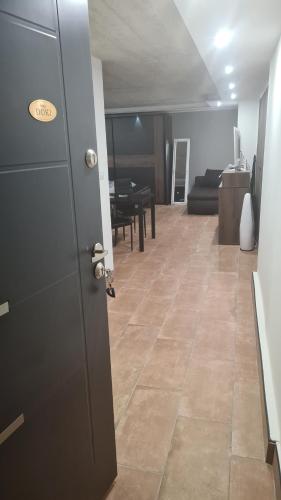 a open door to a living room with a table at STUDIO apartment Doki BASEMENT in Pula