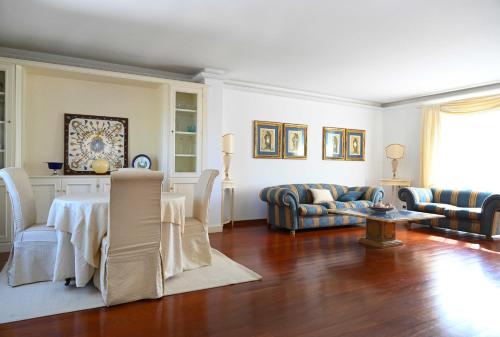 a living room with a couch and a table at Aura Relais in Numana