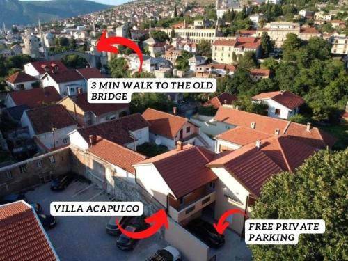 an aerial view of a house with a sign that says km walk to the end at Villa Acapulco in Mostar
