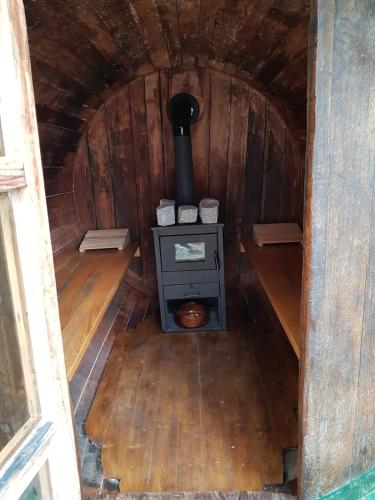 an inside view of a stove in a wooden cabin at Apartman - Vinska Cesta in Ðurđevac