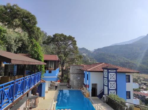 a view of a house with a swimming pool at Belle Vue Ölüdeniz in Fethiye