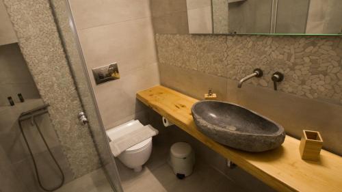 a bathroom with a sink and a toilet at The Olive Yard in Gythio