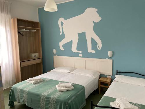 Postel nebo postele na pokoji v ubytování Hotel Aloha