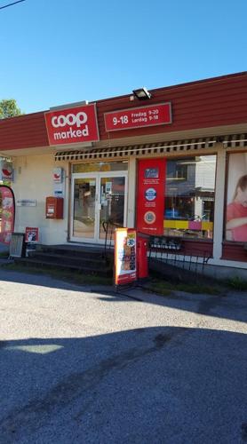 a store with a sign in front of it at 16 - Fulufjellets nasjonalparker - snø - alpint - langrenn - snøscooter in Ljørdal