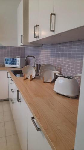a kitchen with two toasters on a wooden counter top at Il Gelso in Pimonte