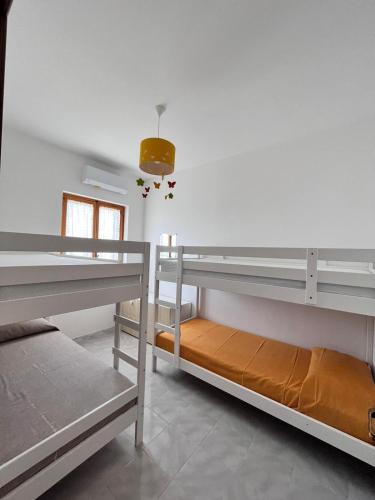 Postel nebo postele na pokoji v ubytování suli e mari