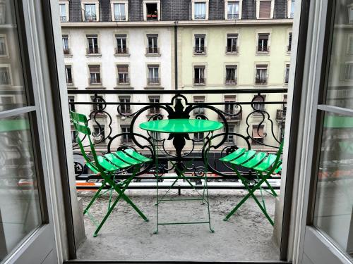 a view of a table and chairs from a window at Luxury Apartment in Central Geneva in Geneva