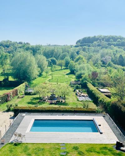 an overhead view of a swimming pool in a field at Vakantiehuis 't Geultje in Schin op Geul