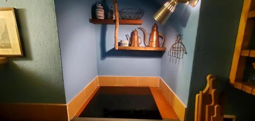 a kitchen with a sink in a room at APP Spiaggia Bianca in Onno
