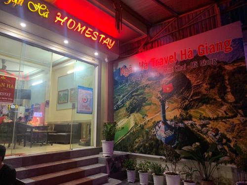 a building with a large mural on the side of it at Ngan Ha Homestay in Ha Giang