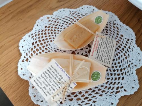 two slices of cheese on a plate on a table at Ferienwohnung Pichler in Leibnitz