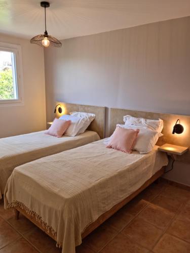 Ένα ή περισσότερα κρεβάτια σε δωμάτιο στο L'ortu di Quaprice