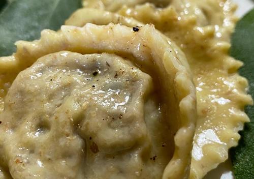 a close up of a piece of pasta with sauce at Camping Village la Verna in Chiusi della Verna