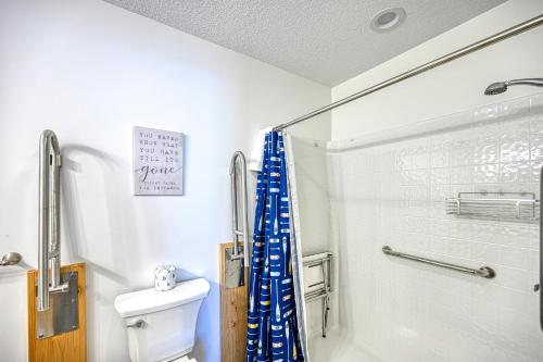 a bathroom with a shower and a toilet at Curb-Free Chalet in McHenry