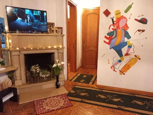 TV a/nebo společenská místnost v ubytování Сибиряк