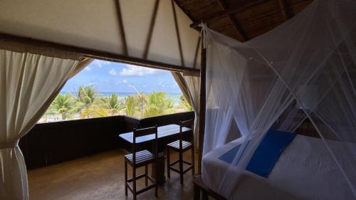 Postel nebo postele na pokoji v ubytování Eco Cabañas Bluekay