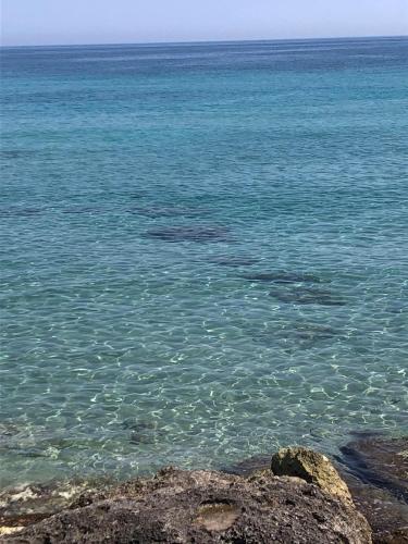 a view of the ocean with rocks in the water at A casa di nonna Lina in Polignano a Mare