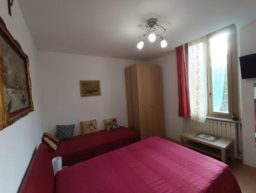 Ένα ή περισσότερα κρεβάτια σε δωμάτιο στο casa Venaria Reale