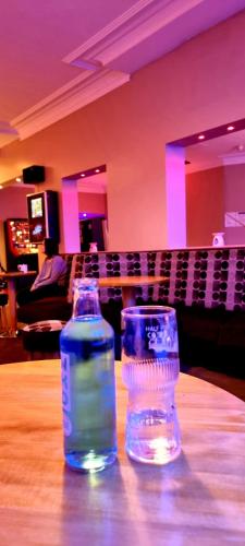 two bottles of water sitting on top of a table at The Avari Beach Hotel in Blackpool