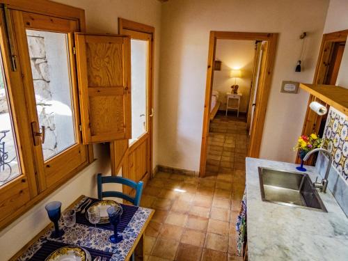 a kitchen with a sink and a counter top at Casa Bedda in Noto Marina