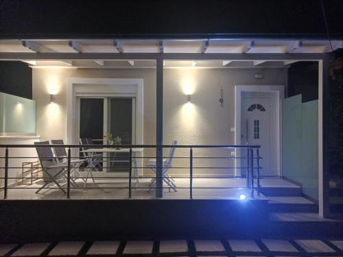 a front porch of a house at night at Villa Christos Family Bungalow Pachis Beach-Glyfoneri in Pachis