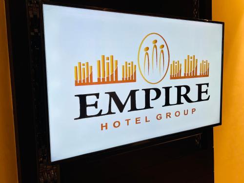 a sign for an empine hotelgroup is shown at Hotel Delhi 55 -City Center in New Delhi