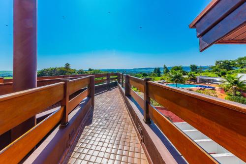 a balcony with a view of a pool at Hotel Boutique Frangipani in Brotas