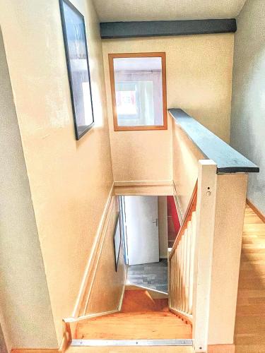 a staircase in a house with a stair case at Ti Kaz Auberge in Saint-Just