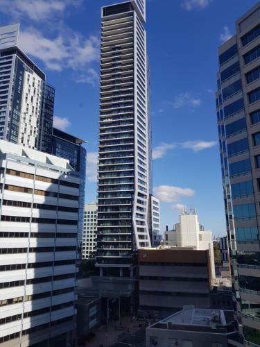 a view of a city skyline with tall buildings at Chatswood Hotel Apartment in Sydney