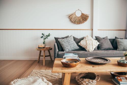 a living room with a couch and a coffee table at Joy Apartment 3 in Lorne