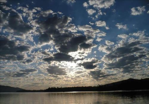a cloudy sky over a body of water at Whispering Pines - Big Bear Lake in Big Bear Lake
