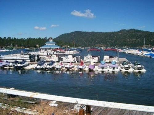a bunch of boats docked in a harbor at Whispering Pines - Big Bear Lake in Big Bear Lake
