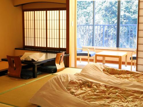 Postel nebo postele na pokoji v ubytování Hakone Pax Yoshino