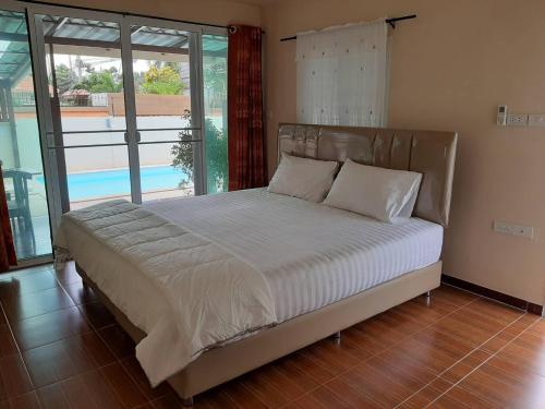 Кровать или кровати в номере La Mer at Huahin