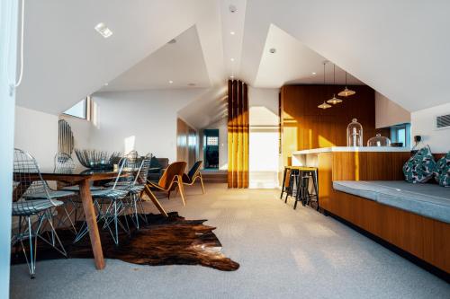 a kitchen and dining room with a table and chairs at Cremorne Point Manor in Sydney