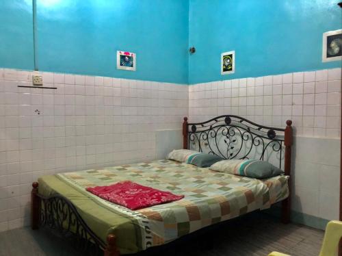 Ένα ή περισσότερα κρεβάτια σε δωμάτιο στο Greenleaf Guesthouse