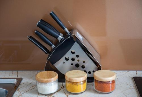 a toaster sitting on top of a counter with spices at Nesta - The Grand Hao Nam in Hanoi