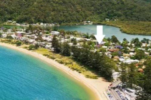 an aerial view of a resort on a beach at Patonga Street Retreat in Patonga