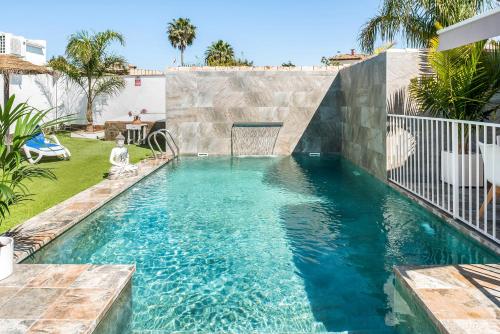 a swimming pool with a goal in a backyard at Casa Mirajanda in Vejer de la Frontera