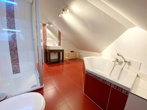 a bathroom with a sink and a toilet at Ferienhaus Sabrina in Sassnitz