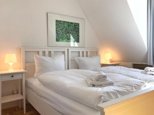 Postel nebo postele na pokoji v ubytování Ferienhaus Captain Hook