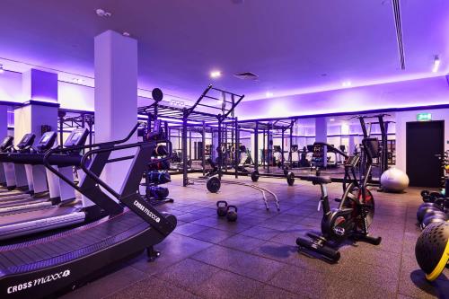a gym with a lot of treadmills and machines at Radisson Collection Hotel, Warsaw in Warsaw