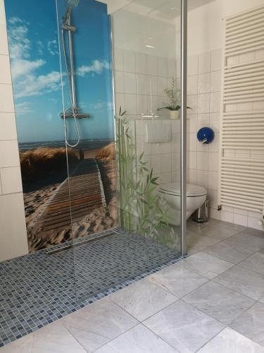 a bathroom with a shower and a toilet in it at Ferienhaus Franzy in Sassnitz