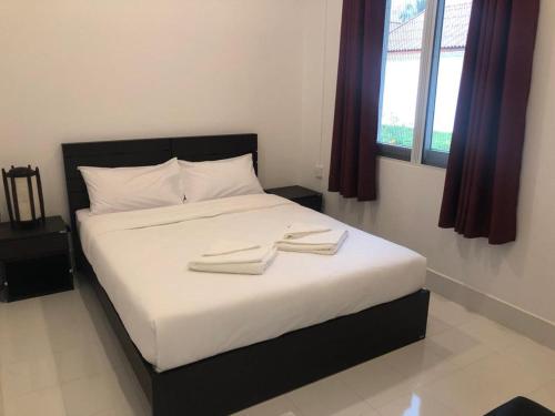 מיטה או מיטות בחדר ב-River View Villas