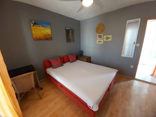 Posteľ alebo postele v izbe v ubytovaní Kia Ora Apartment