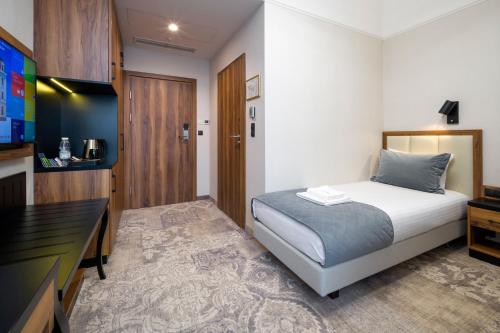 Katil atau katil-katil dalam bilik di Sky Hotel Kraków