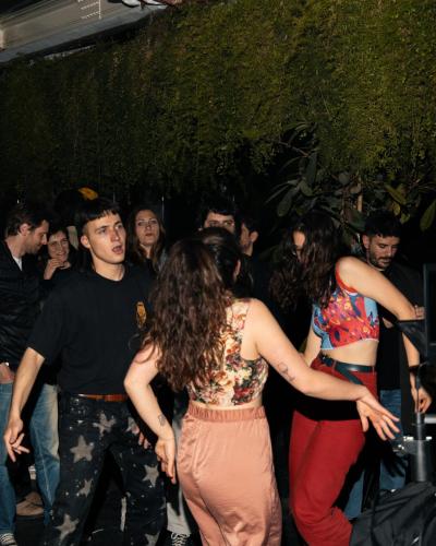 a group of people dancing at a party at Combo Milano in Milan