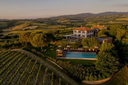 an aerial view of a villa with a swimming pool at Roccafiore Spa & Resort in Todi